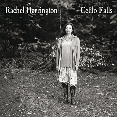 Black and white album cover with a woman standing in a wooded area.