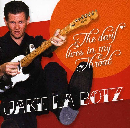 Man in black holding white guitar, album cover with red and orange background.