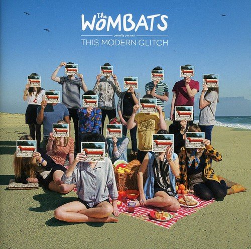 "Album cover with group of people on beach holding cameras over their faces."
