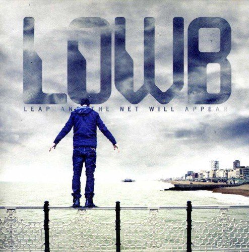 "Album cover with man standing on railing, arms outstretched, against a cloudy sky."