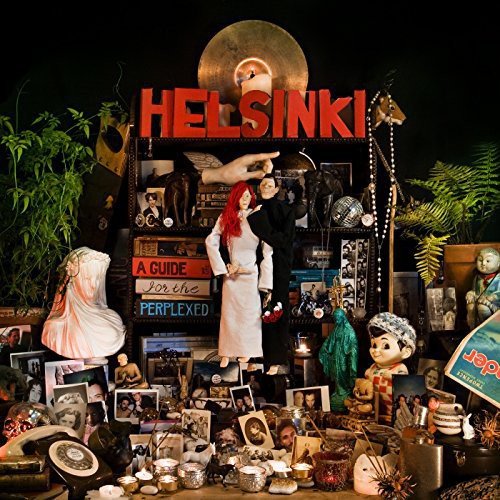 "Album cover with 'Helsinki' in red, surrounded by eclectic, vintage items and mannequins."