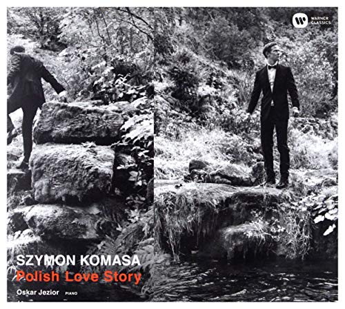 Black-and-white album cover with a man in a tuxedo standing on rocks.