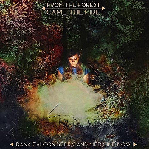"CD album cover featuring a person surrounded by forest and smoke."