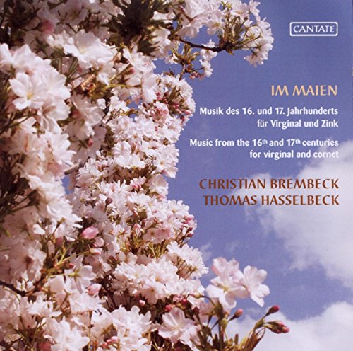"CD cover with blooming tree branches against a blue sky with white clouds."