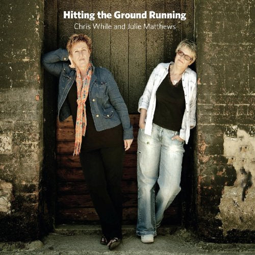 "Album cover with two women standing in a doorway, wearing casual clothing."