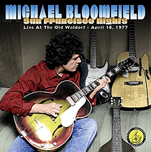 Michael Bloomfield playing a guitar, with two guitars behind him, on a CD cover.