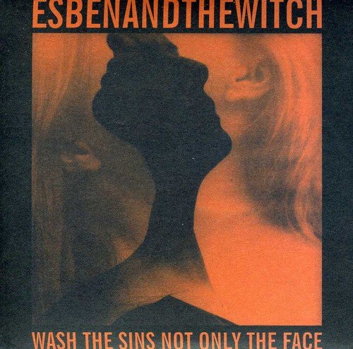 Album cover with silhouette of a woman's head and orange text on dark background.