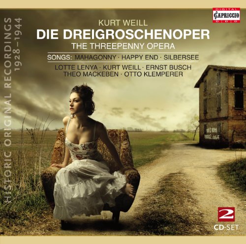 "Woman in white dress sits on ornate chair on a dirt road."
