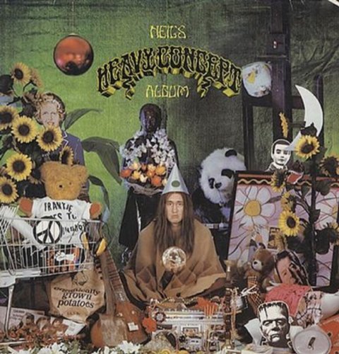 "Album cover with surreal, collage-style artwork featuring a man surrounded by eclectic objects."
