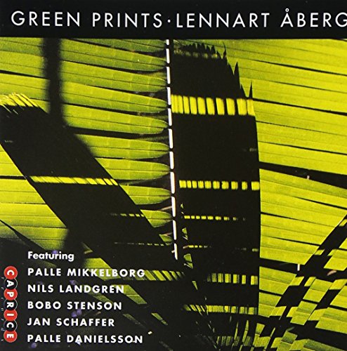 The image is a CD cover featuring a black and yellow abstract design with text.