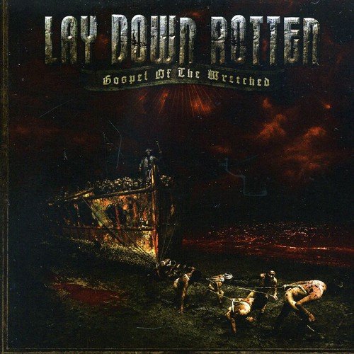 "Album cover art: 'Lay Down Rotten - Gospel of the Wretched' with dark, eerie scene."