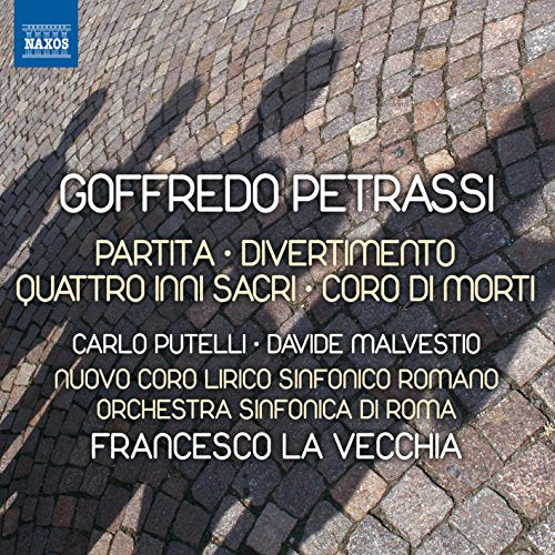 CD cover with white and yellow text on a cobblestone background.