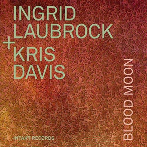 Album cover with red, textured background, featuring artist names and title "Blood Moon".