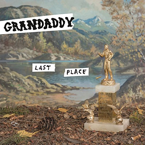 "Album cover with 'Grandaddy' and 'Last Place' text, featuring a trophy on a forest floor."