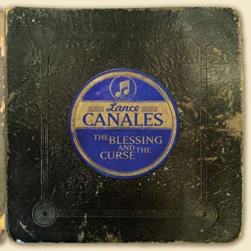 CD case with blue and gold label, worn black cover, on a beige background.