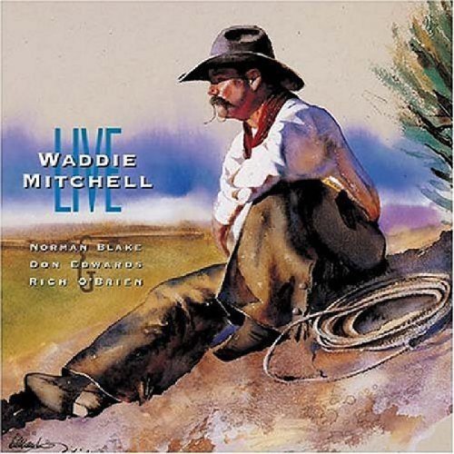 "Waddie Mitchell Live" CD cover featuring a cowboy sitting on a rocky outcropping.