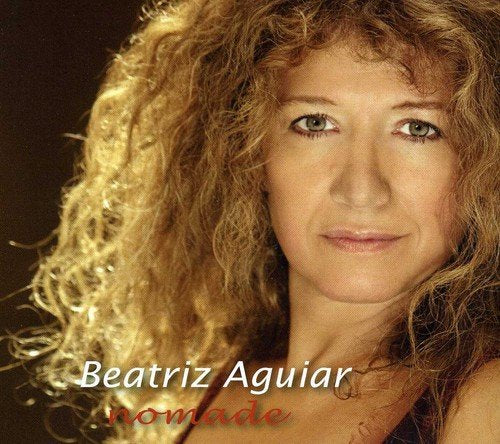 Album cover featuring a close-up of a woman with curly blonde hair and green eyes.