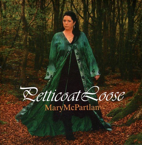 The alt text for the image is: "Album cover featuring a woman in a forest, wearing a green cloak."