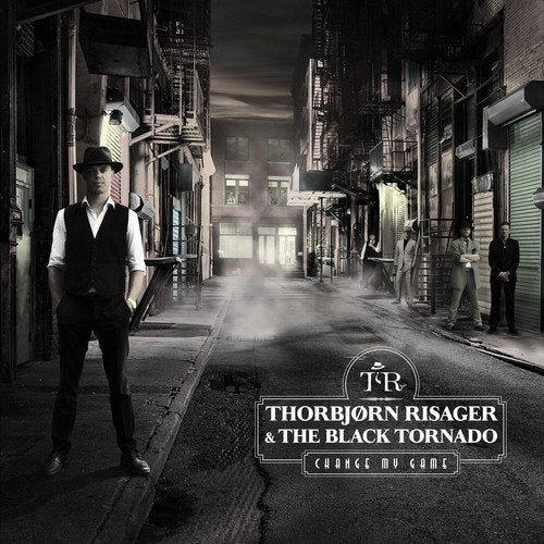 "Album cover featuring a man in a dark alleyway with text overlay."