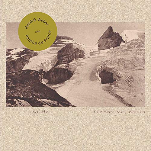 "CD cover with a sepia-toned mountain landscape and gold circular label."