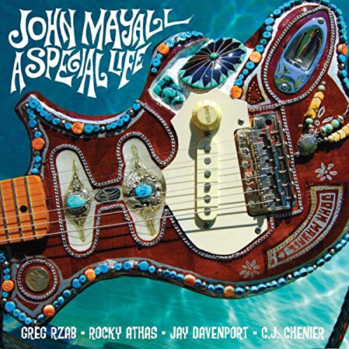 "Album cover with decorated guitar against a blue background, artist and title displayed."