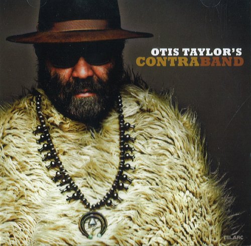 Album cover featuring a man with a beard, wearing sunglasses, hat, and fur coat.