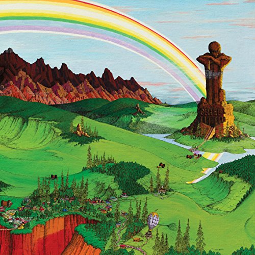 "Album cover with a rainbow arching over a green landscape and a statue."