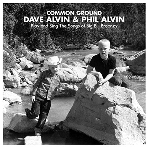 Black and white album cover with two men standing by a rocky stream.