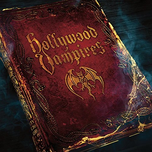 Red leather-bound album cover with gold text and bat emblem on a dark surface.