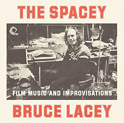 Vinyl album cover featuring a black-and-white photo of a man in a cluttered room.