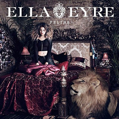 "Ella Eyre's album cover featuring a woman on a bed with a lion."
