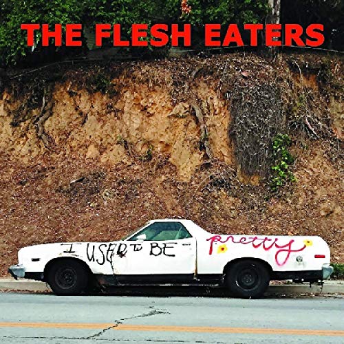 "Album cover featuring a white car with graffiti on the side, parked by a hillside."