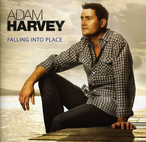 Album cover featuring Adam Harvey sitting on a dock with a cloudy sky.