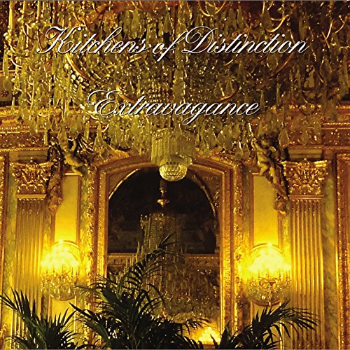 "Luxurious gold-framed archway with crystal chandeliers and lit wall sconces, surrounded by green plants."