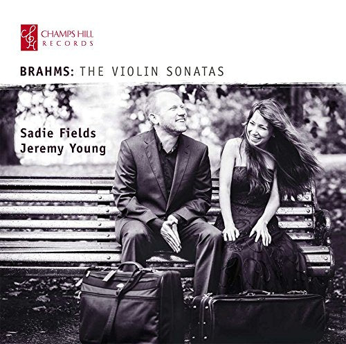 Black and white CD cover featuring a man and woman sitting on a bench together.