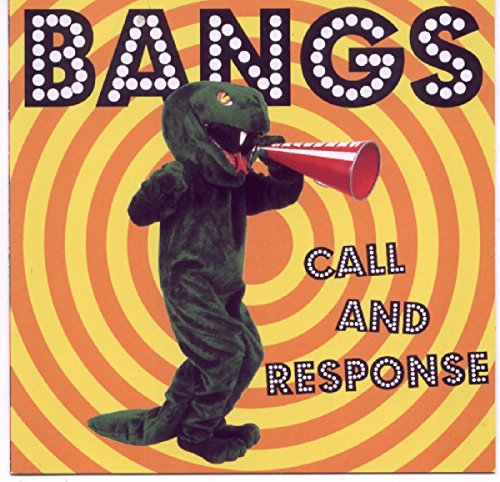 The image shows a CD cover with a dinosaur in a costume holding a megaphone. Alt text: CD cover with dinosaur in costume holding megaphone, on yellow and orange background.