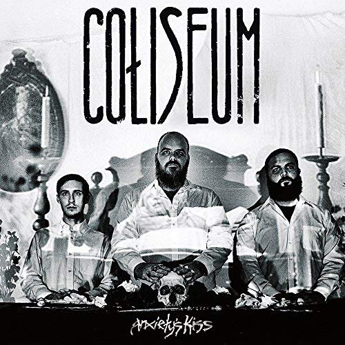 "Black and white album cover with three men and candelabras."