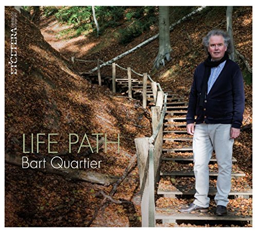 "Album cover with man standing on wooden stairs in a forest, 'Life Path' written."