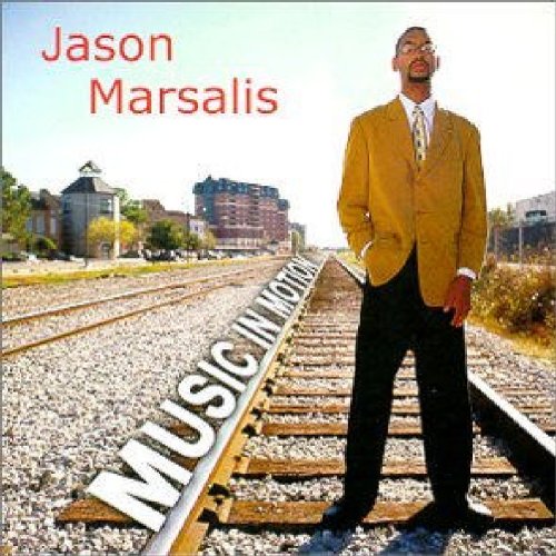 "Album cover featuring Jason Marsalis standing on train tracks with cityscape in the background."