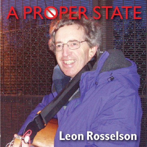 "Album cover with a man holding a guitar, wearing a blue jacket."
