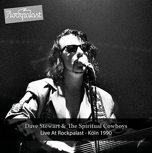 Black and white vinyl album cover featuring a man singing into a microphone.