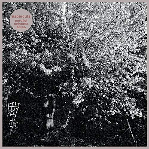 "Album cover with black and white forest image, red text, and abstract white designs."