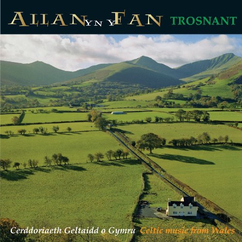 "CD cover with serene Welsh landscape, mountains, and a white house."