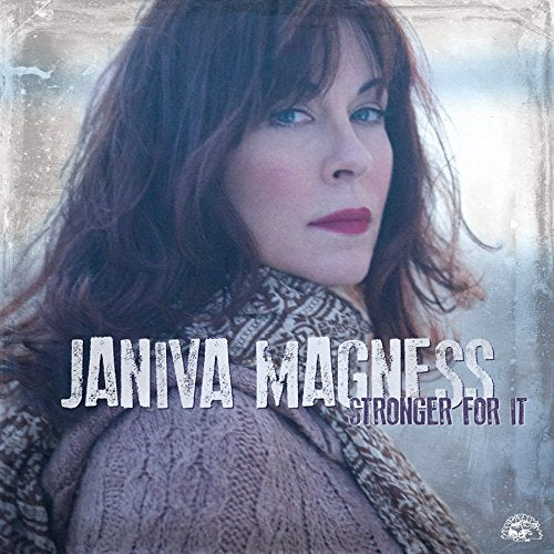 "CD album cover featuring a woman with long brown hair and a knit sweater."