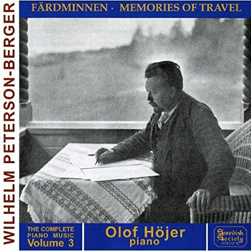 "Black and white album cover with man writing at a table by a window."
