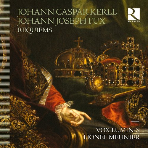 A CD cover featuring a hand holding a crown against a dark background.