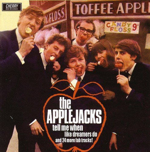 "CD cover featuring a band in suits eating candy in front of a candy shop."