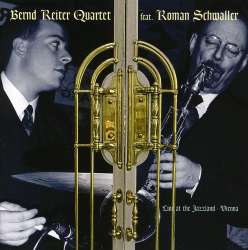 CD album cover featuring two musicians with a gold door in the foreground.