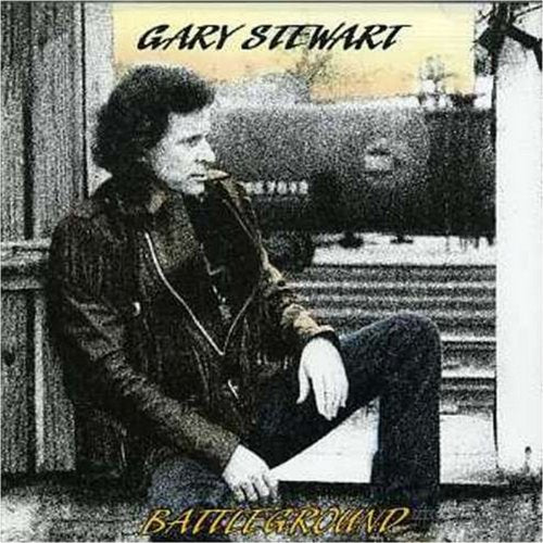 CD case cover with black and white image of man sitting on steps.