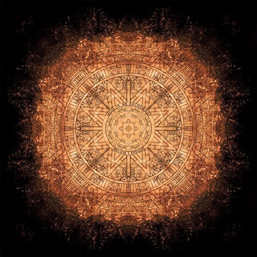 The image depicts a circular, intricate design with a black background. For accessibility purposes, a suitable alt text could be: "Ancient calendar or mandala on a black background."